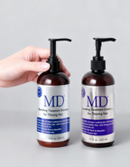Hands holding the MD Revitalizing Shampoo and Conditioner bottles together