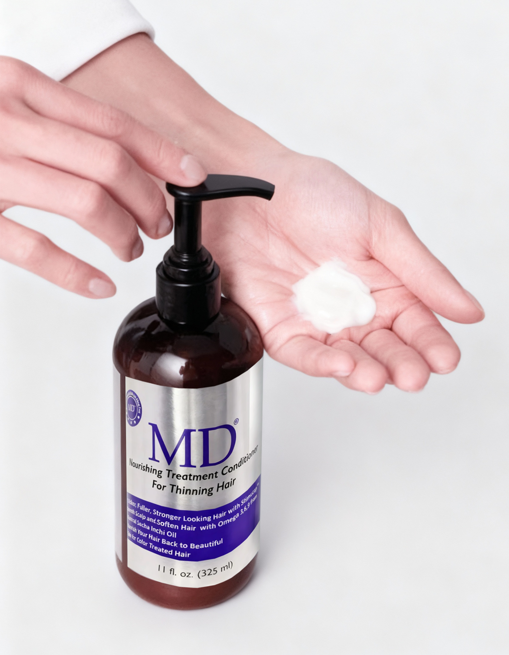 Applying MD Revitalizing Conditioner to mid-lengths and ends for breakage repair