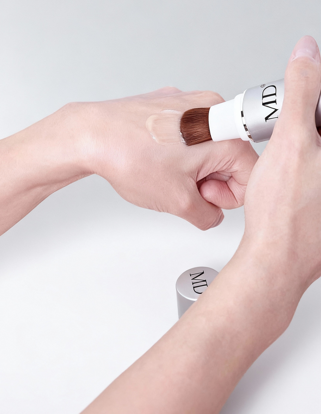 Close-up of the MD Follicle Energizer precision brush tip for direct scalp application